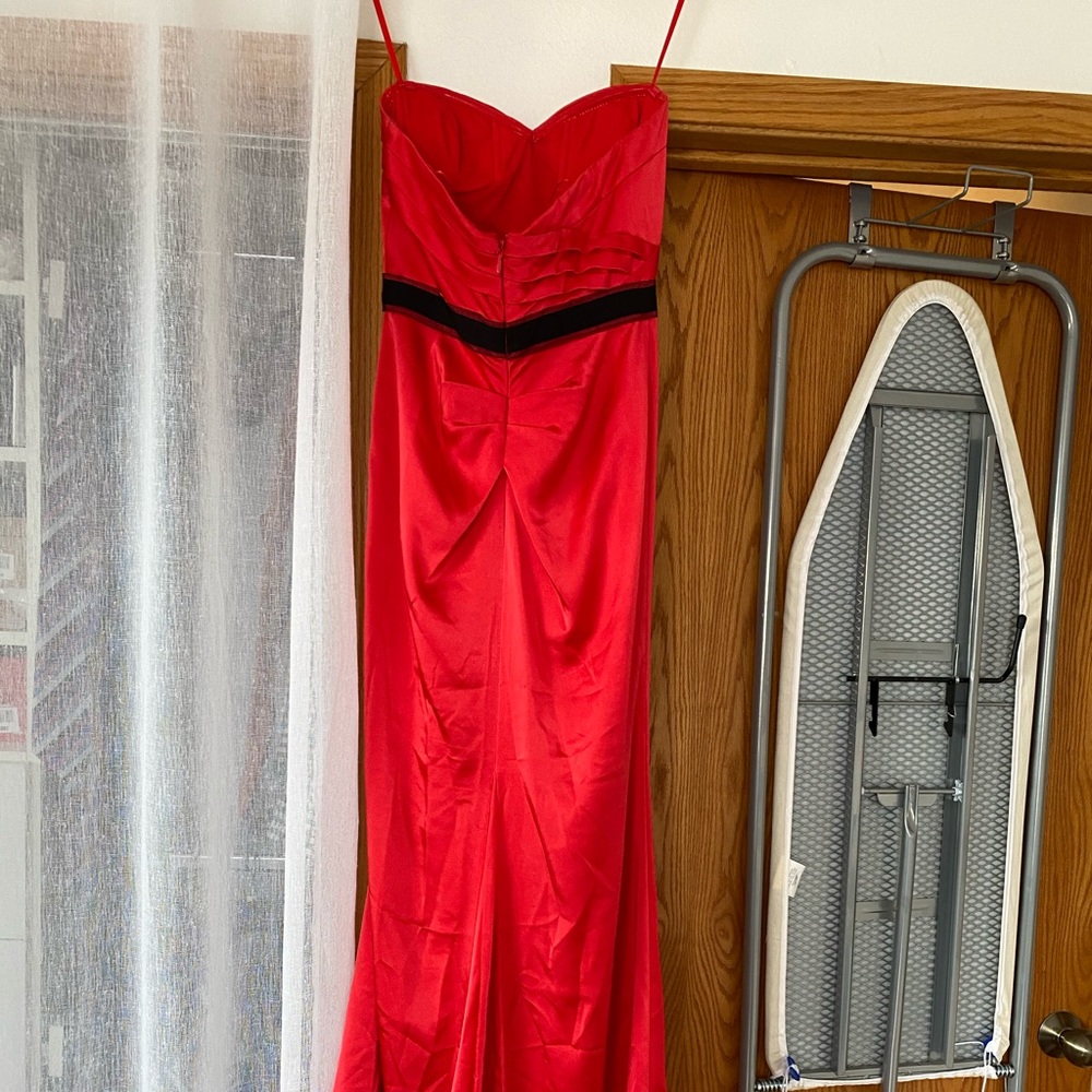 Strapless Red BCBG gown with small kick train.